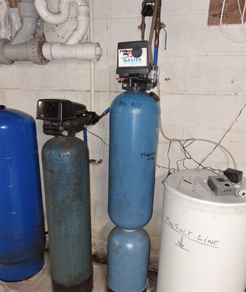 Another aging well-water treatment system, with hand-labeled mineral and max-salt lines, sent to Gridline by a homeowner ahead of replacement
